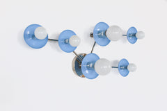 Taurus constellation wall sconce in Celestial Blue with sleek chrome arms and white globe bulbs, handmade in New Orleans by Sazerac Stitches. A modern celestial light for pastel bedrooms, hallways, nurseries, and elegant contemporary interiors.