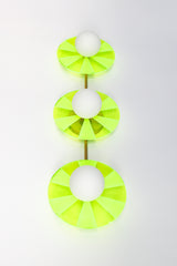Neon Green Triple Circus Sconce: Steal the show with a touch of modern luxury! The Neon Green Triple Circus Sconce features three intricately etched green acrylic discs, drawing inspiration from the rich hues of Murano glass. Each disc casts mesmerizing light and shadow patterns, making this statement piece a true conversation starter.