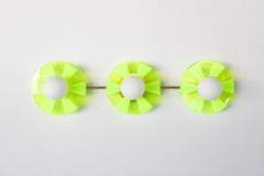 Neon Green Triple Circus Sconce: Steal the show with a touch of modern luxury! The Neon Green Triple Circus Sconce features three intricately etched green acrylic discs, drawing inspiration from the rich hues of Murano glass. Each disc casts mesmerizing light and shadow patterns, making this statement piece a true conversation starter.