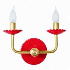 Playful and feminine, cherry-colored wall sconce with brass accents.  Features scalloped bobesche cups and a red wall plate. Great for kids spaces, jewel-box bathrooms, creative & eclectic energy rather than anything moody or earthy. It works as an easy focal point for a maximalist dining room, a colorful hallway, or a kids' bathroom that wants a bold color instead of a themed motif.