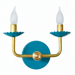 Rich and glossy, this peacock teal reads more jewel box than coastal, sitting on the same scalloped bobeche cups and raw brass arms as the rest of the line. It has enough saturation to anchor a Chinoiserie-leaning powder room, a dramatic dining room, or any wall ready for a color with real depth to it.