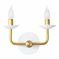 A crisp white and brass wall sconce that works as easily in a powder room as it does in a bedroom or hallway. The Two-Light Adele pairs a clean white powder-coated finish with warm brass arms and a scalloped, flower-shaped bobeche under each candle. Traditional and grandmillennial-leaning, it's the versatile kind of fixture that plays well with wallpaper, millwork, and collected pieces. Available in a range of powder-coated colors for rooms with personality.