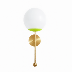 A zingy chartreuse globe sconce for a powder room, bedside, or hallway that isn't afraid of color. The Verbena Sconce tops a round brass backplate with a slim brass stem, seats a white glass globe in a bright chartreuse cup, and finishes the bottom with a small brass ball, the kind of detail that makes it feel custom. Chartreuse and brass together read fearless and a little unexpected, the boldest version of the design, striking flanking a mirror, art, or a bed, especially against a moody or saturated wall.