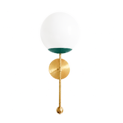 A jewelry-like globe sconce for a powder room, bedside, or hallway that wants a wall light with real personality. The Verbena Sconce tops a round brass backplate with a slim brass stem, seats a white glass globe in a mermaid-green cup, and finishes the bottom with a little brass ball, a small detail that makes the whole thing feel custom. The green-and-brass pairing reads collected and vintage-modern at once, lovely flanking a mirror, art, or a bed. A soft, glowing light source for mid-century, colorful tra