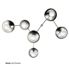 Virgo six-light sculptural wall sconce in All Chrome, with reflective circular disc shades, exposed white globe bulbs, and slim branching metal arms arranged in the shape of the Virgo zodiac constellation. A celestial statement light combining modern wall lighting with functional wall sculpture.