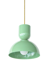 pastel green is the color that makes a kitchen feel happy and alive, and this Taeuber pendant leans right into it. The two-part silhouette stacks a rounded cup over a wide domed bell, all finished in a glossy spring green with a warm brass stem, shown here lit and glowing. It reads bold, cheerful, and very design-forward, the kind of statement lighting that turns an island, breakfast nook, or sink into a real focal point. Hang one as a jolt of color or a row for maximum impact. A great choice for a maxi