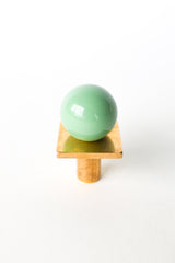 Pastel green and solid brass square gumball drawer pull with high-gloss finish—perfect hardware for playful cabinets, colorful kids’ rooms, modern bathrooms, or kitchen updates. Adds soft minty charm and midcentury modern style to any dresser, vanity, or DIY furniture project.