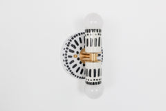 Handpainted black and white patterned wall sconce inspired by Greece & Portugal.  Maximalist style wall sconce that has a natural element because each one is hand-painted.  The painted thalia is a perfect small sconce that doubles as a statement light fixture because of the bold design.  Great for bathrooms, hallways, and more.   