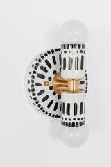 Handpainted black and white patterned wall sconce inspired by Greece & Portugal.  Maximalist style wall sconce that has a natural element because each one is hand-painted.  The painted thalia is a perfect small sconce that doubles as a statement light fixture because of the bold design.  Great for bathrooms, hallways, and more.   