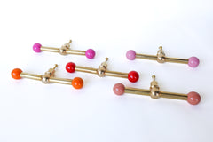 colorful brass and powdercoated wide double gumball knobs by sazerac stitches.  Color variety of fun and interesting drawer pulls made in New Orleans