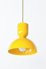 All yellow& brass bold geometric pendant light with a dome shade. glossy finish. Great kitchen pendant light. Good for small spaces or small dining tables. Bold, mid-century modern style pendant light that is great for maximalists or eclectic style decor. 