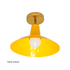The Bruxelles Flushmount in a clear, sunny yellow is built for ceilings that can't fit a hanging pendant, with a wide, angled shade and warm brass hardware that keeps it feeling considered rather than novelty. It works well over a kitchen island, in an entryway, or lighting a hallway, laundry room, or playroom, anywhere you want real color overhead without losing headroom.
