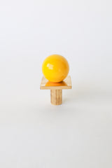 Yellow and brass Square Gumball Knob by Sazerac Stitches, featuring a glossy powder-coated steel sphere on a square raw brass base. Handmade cabinet hardware perfect for colorful kitchens, midcentury modern furniture, and bathroom vanities. Customizable in 30 bold colors.