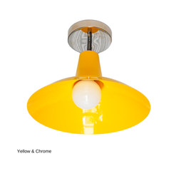 This version of the Bruxelles Flushmount pairs the same sunny yellow shade with cool chrome hardware instead of brass, giving it a crisper, more modern edge. It solves the same low-ceiling problem with a design-forward shape, whether that's over a kitchen island, in an entryway, or lighting a hallway or laundry room.
