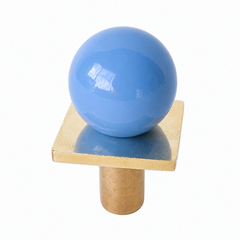 colorful and structural drawer pull features a powdercoated pastel blue colored ball on a brass square with a small foot, making it easy to grab as well as gorgeous. Made with real brass, this knob will patina with time if you want it to. 