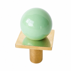 colorful and structural drawer pull features a powdercoated mint colored ball on a brass square with a small foot, making it easy to grab as well as gorgeous. Made with real brass, this knob will patina with time if you want it to. 