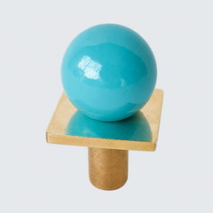colorful and structural drawer pull features a powdercoated pastel turquoise or aqua blue colored ball on a brass square with a small foot, making it easy to grab as well as gorgeous. Made with real brass, this knob will patina with time if you want it to. 