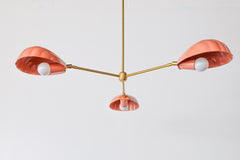 Peach and brass coastal instpired shell chandelier has a playful art deco vibe with its brass accents