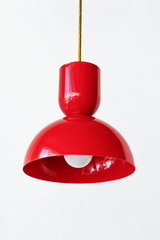 Cherry red is the color that instantly wakes up a kitchen, and this Taeuber pendant brings it in a punchy, sculptural shape. The two-part silhouette stacks a rounded cup over a wide domed bell, all finished in a glossy red powder coat with a warm brass stem. It reads playful and confident, exactly the kind of statement lighting that turns an island, a breakfast nook, or a sink into a focal point. Hang one as a pop of color or a row for real impact. A great choice for a colorful, collected home that treats r