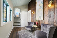 Reclaim wood walls, large hallways with sitting room and antique style brass lights