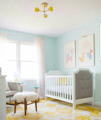 Pastel nursery design with a yellow and white Daisy Loa Ceiling Fixture