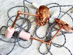 Copper and Pink sconces with black and white cords modern decor