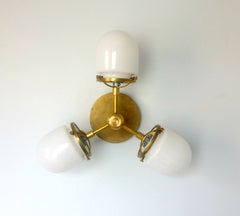 modern brass sconce with glass