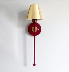 Brass and black cherry modern accent lighting with a gold shade