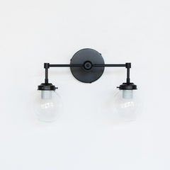 two light matte black bathroom vanity light fixture with clear glass globes