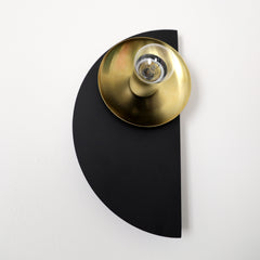 Black and Brass Modern Kin sconce from the bottom