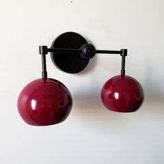 Dark purple and black mid century modern two light wall sconce for bathroom or kitchen renovations
