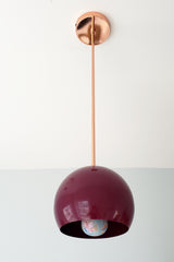 Copper and Maroon pendant light with a globe shade