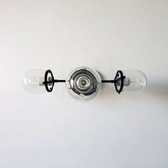 Clear glass and matte black three light bathroom wall sconce or vanity lighting for modern bathroom renovations