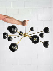 Black and brass spunik style chandelier made by Sazerac Stitches