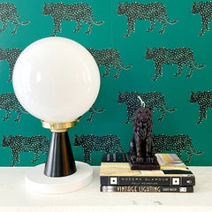 Green cheetah wallpaper with a colorblocked modern lamp made by Sazerac Stitches