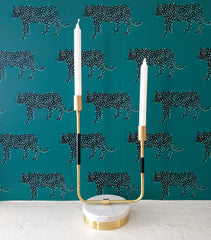 black, brass, and marble candle holder against green cheetah wallpaper.  Made by Sazerac Stitches