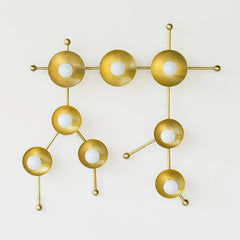 Brass sconce or flush mount ceiling light in the shape of  the Gemini constellation.  Astrology inspired light fixture