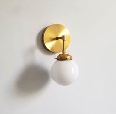 white globe wall sconce brass light fixture mid century modern lighting
