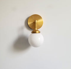 brass globes wall sconce with white shade modern lighting bathroom fixture
