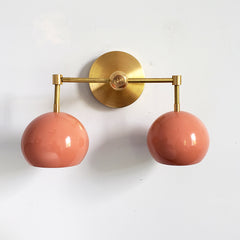 Brass and Peach Double Loa Sconce midcentury inspired modern lighting with boho flair
