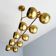 Brass modern chandelier with globe shades.  For oversized dining rooms or kitchen islands