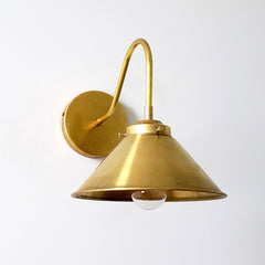 all brass wall sconce with a cone shade.  Great for modern farmhouse kitchens and open shelving