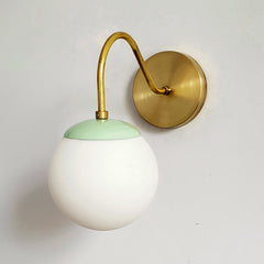 Brass and Mint Fontainebleau curved arm sconce modern design side view