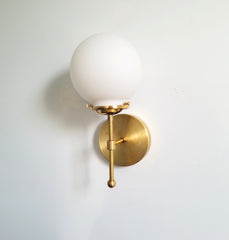 white glass globe wall sconce with brass bathroom light fixture interior lighting modern minimalist scandinavian hygge