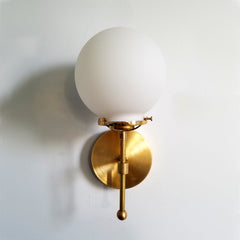 white glass globe wall sconce with brass bathroom light fixture interior lighting modern minimalist scandinavian hygge