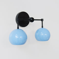 Pastel Blue and black two light bathroom wall sconce side view