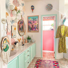 Pastel Boho bathroom with a large sconce made by Sazerac Stitches