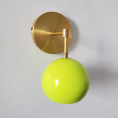 mid century modern inspired sconce in chartreuse green and brass