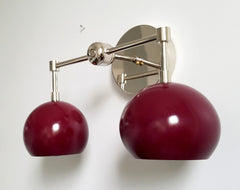 Mid century inspired wall sconce with black cherry shades