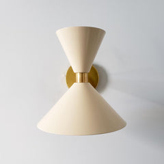 Cream and brass midcentury modern inspired cone wall sconce